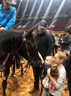 Kids petting horse