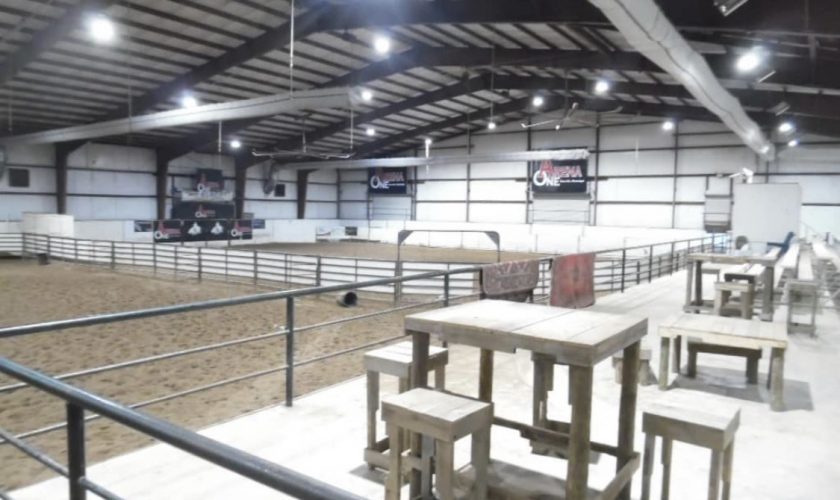 the inside of a horse arena
